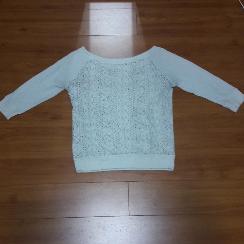A cream color shirt